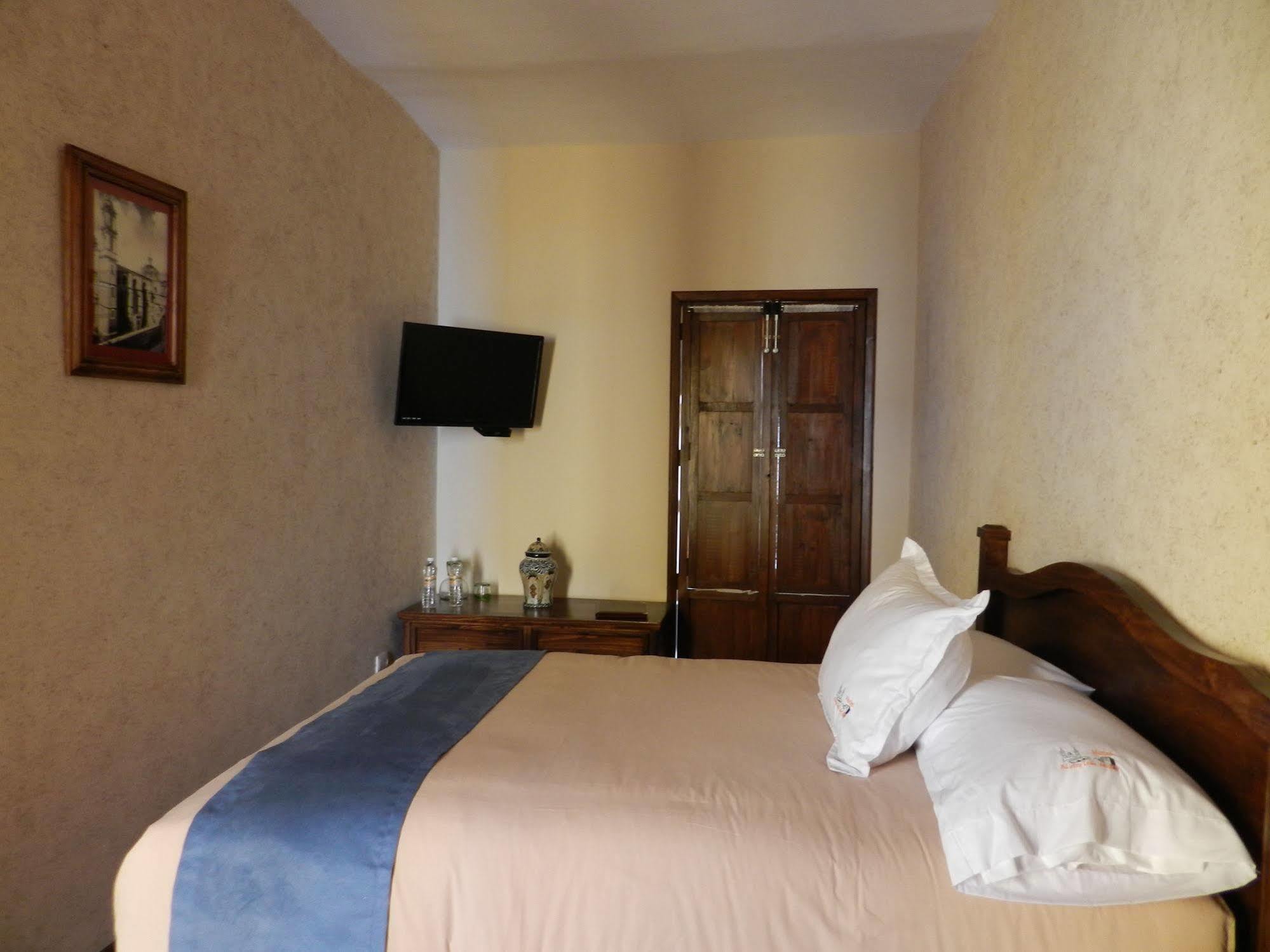 Collection O Al Otro Lado Del Rio, Puebla Hotel Exterior photo A room at the hotel