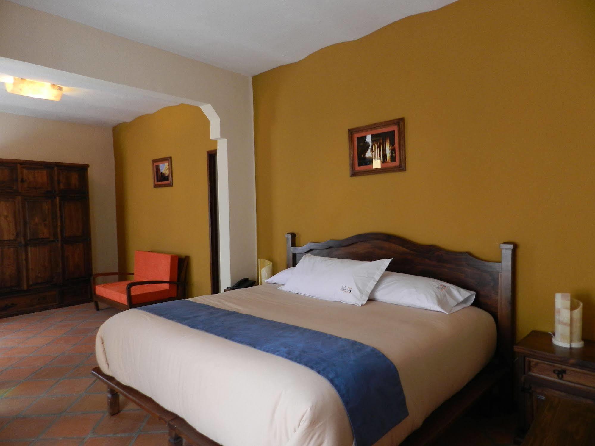 Collection O Al Otro Lado Del Rio, Puebla Hotel Exterior photo A bedroom at the hotel