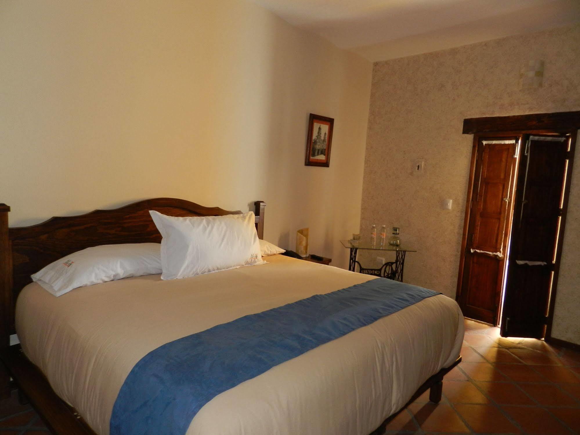 Collection O Al Otro Lado Del Rio, Puebla Hotel Exterior photo A bedroom at the hotel